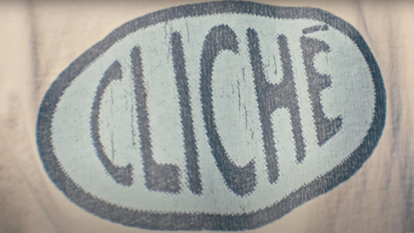 The word cliché written on a shirt