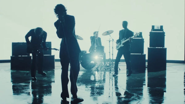 sombr singing with a band on the back to friends music video.